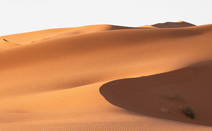 A beautiful scenery of sand dunes in a desert area on a sunny day